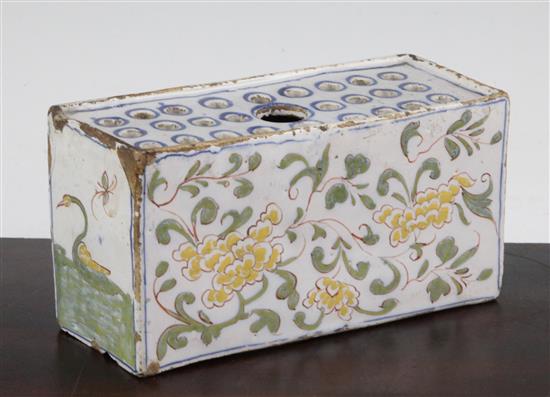 An English delftware polychrome flower brick, c.1760, possibly Liverpool, 17.5cm.